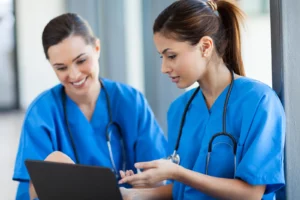 Budget-Friendly Direct Primary Care. Doctor holding digital tablet at meeting room