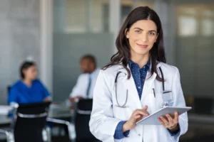 More Doctors Available. Doctor holding digital tablet at meeting room