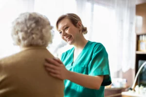 Friendly nurse supporting an elderly lady Slashing Healthcare Expenses